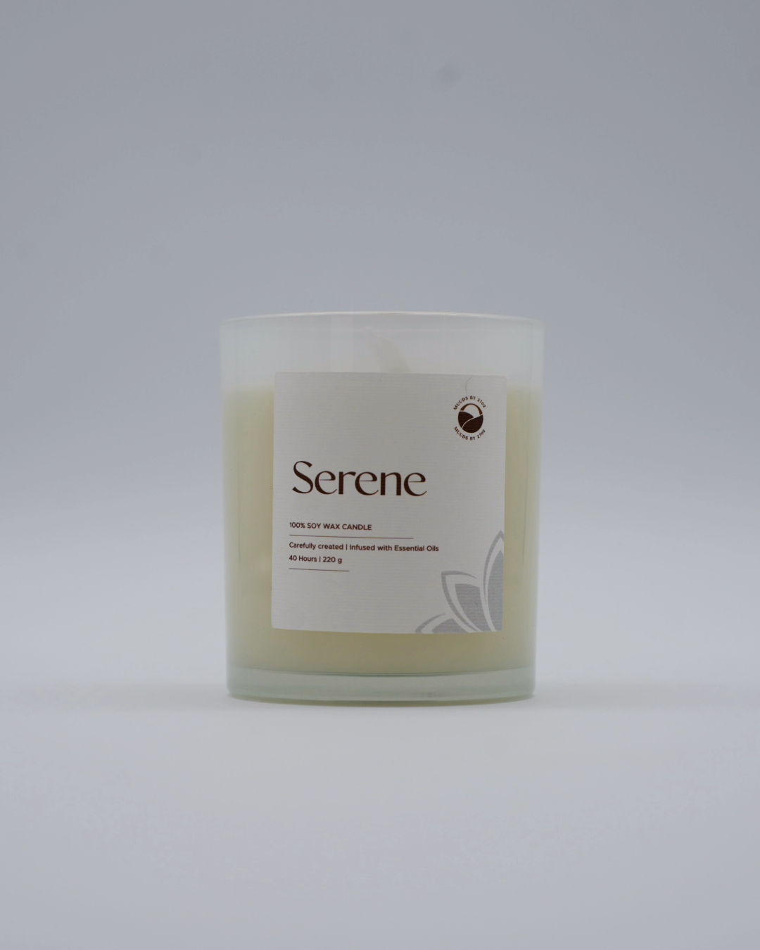 Candle labeled 'Serene' on a light gray background